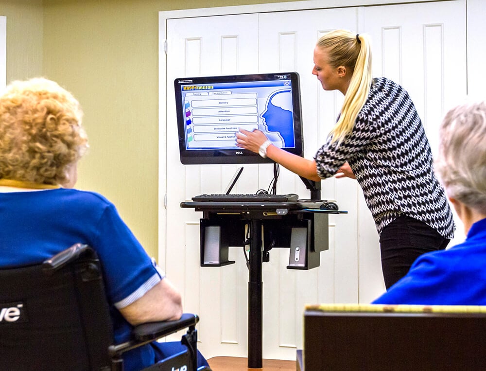 A woman uses LifeLoop with residents