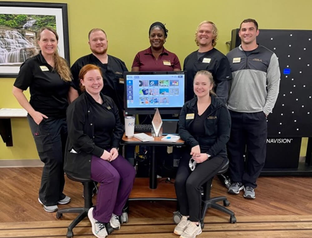 Seven coworkers gather around their LifeLoop